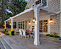 Example of a large classic backyard patio design in New York with a pergola