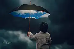 A little boy with an umbrella