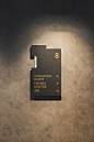  Directional signs in layers of brushed brass and matte textured anthracite paint 