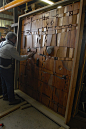Carved teak doors by acclaimed sculptor, the late LeRoy Setziol, recently reclaimed by McGee Salvage, purveyors of fine reclaimed woods and floors.