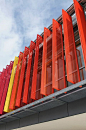 Colorful metal slats to control light and shadow on the facade of an elementary school | Architect: Krug & Partner GbR Architekten, Munich: 