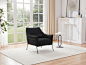 Fauteuil en tissu sherpa effet peau de mouton noir style design LOVENA
