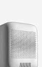 This may contain: a white wall mounted air purifier sitting on top of a table