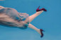 Solomia Underwater P1 : Woman in grey dree and violet heel shoes underwater
