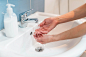 person-washing-hands-with-soap_23-2148602220