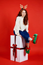 Portrait of girl with huge christmas present