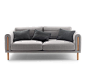 Cozy gray sofa with blanket style upholstery that makes it ideal for lounching