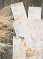 Imperfect gold foil adorned Found and Created's skinny invites, which were backed with classic love quotes.