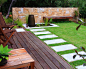 Greenwich : A stylish front entry garden featuring stone clad feature wall, sunken water feature and floating bench seat.  A contemporary garden designed to suit a busy family.