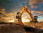 Excavator-at-a-construction-site-against-the-setting-sun.-143918313_5000x38601-scaled