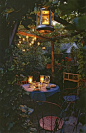 Romantic candlelit dinner for two under the vine-covered pergola.