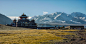 Black and White House Near Mountains Under Blue Sky