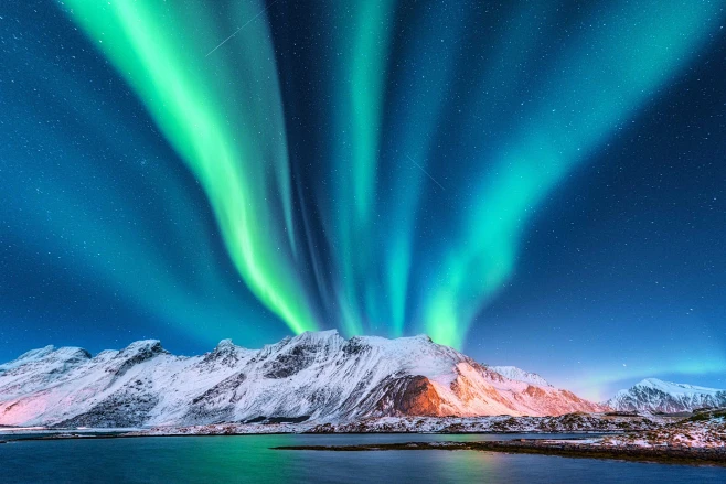 Green Northern Lights Above A Mountain 
