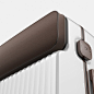 a white and brown piece of luggage is shown