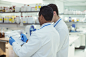 Scientists taking notes in laboratory by Caia Images on 500px