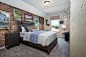 Inspiration for a mid-sized contemporary guest carpeted and gray floor bedroom remodel in Other with white walls