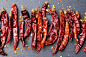 Dried red chili peppers on slate background Top view Copy space by Anna Pustynnikova on 500px