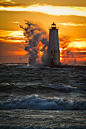 Lighthouse, Waves, and Sunset Frankfort, Michigan  by ETCphoto