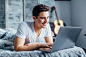 beautiful-pretty-man-sitting-by-internet-his-laptop