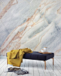 With no sign of slowing down, marble still remains one of the most popular materials in design. While applying marble to the walls seems like a farfetched (and expensive) idea outside of the bathroom