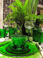 Place setting with green glassware