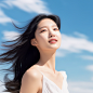 A Korean beauty with very white and delicate skin enjoying the sun outdoors with a natural expression on her face, and long fine black hair cascading down. She is featured in a whitening skincare product advertisement poster with a blue sky and white clou