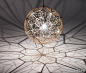 [抽象球形灯] 英国设计师Tom Dixon设计的灯具Luminosity，其中一个引人注目的设计是有着抽象球形灯罩的“Etch Web”。Etch Web”宽65cm，整个球体表面由重复的不规则五边形组成。每五个钻石形相连，组成一个组团，最终形成有系统的光滑的球面。当内部灯泡发光，这个极具未来感的金属灯罩便投射出复杂的尖角灯影。
