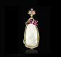 NEPHRITE PENDANT CONTINUOUS SUCCESS   This nephrite portrays a heron (”lu” meaning road) and a lotus (”lian” meaning continuous), wishing one endless success.  18K yellow gold carved nephrite pendant set with diamonds, rubies and pink sapphires for a tota