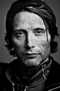 People 1276x1920 men actor portrait portrait display beards Mads Mikkelsen monochrome looking at viewer depth of field hat simple background