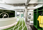 Onefootball HQ by TKEZ features turfed meeting rooms and running track : A three-lane running track weaves around this office for a football app company, by TKEZ, leading to goals for penalty shootouts during work breaks