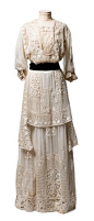 Embroidered marquisette dress, c. 1910  --  The layers of this magnificent dress are covered with embroidery and lace insertion, and set off with a black velvet ribbon belt. It bears a label: “Mrs. DeWitt / 5 W. 31st St., N.Y.” It was worn by Cornelia Wit