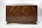 Macassar Ebony two door cabinet with Sunburst veneering and bronze finish metal leaf details.: 