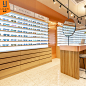 时尚品牌眼镜集合店展示柜带灯靠墙眼镜展柜木质层板眼镜展示架台