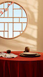 Circular pane,a table setup with a red table cloth and a beautiful arrangement of cherry blossoms, in the style of zen buddhism influence, mirror, light brown and beige, clemens ascher, tondo, imitated material