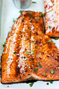 Close up picture of baked salmon with a sticky and dark soy glaze.
