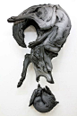 Wolf & rabbit clay sculpture by Beth Cavener Stichter. It's almost abstract-looking until you examine it more closely!