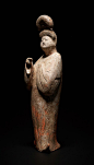 COURT LADY WITH TALL HAIR BUN Terracotta with painting. China, Tang Dynasty (618 - 905)