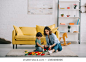 Mother and son playing on carpet in living room