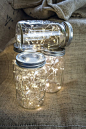 Fill your Mason jars with short strings of fairy lights for a magical source   of light. Image: Pinterest