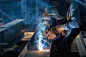 Industrial Worker at the factory Steel welding closeup, Welder