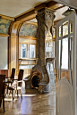 an ornate fireplace in the middle of a room