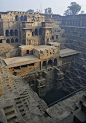 Chand Baori, a stepwell in the village Abhaneri near Jaipur, India. It was built in 9th century and has 3500 narrow steps, 13 stories and is 100 feet deep.: 