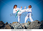 Children training karate on the stone coast - stock photo