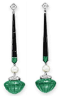 A PAIR OF DIAMOND, EMERALD AND ONYX EAR PENDANTS   Each suspending a carved emerald with a circular-cut diamond cap, joined by a natural pearl, from a calibré-cut emerald and onyx line, to the circular-cut diamond surmount, mounted in platinum. Art Deco o