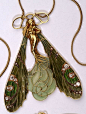 An Art Nouveau dragonfly woman pendant, by René Lalique. Gold, diamond, plique-à-jour enamel.: 