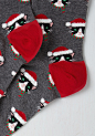  Here Comes Santa Paws Socks | Mod Retro Vintage Socks | ModCloth.com : Make a list and check it twice, and each time you’ll find that these cat socks are oh-so nice! This grey pair brings joy to all thanks to their festively dressed felines, whose hats a