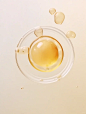 ovum with bubbles floating in water stock photo, in the style of light beige and light amber, aerial view, neo-plasticist, hyper-realistic oil, minimalist photography, kitchen still life, telephoto lens