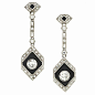 Each earring is composed of bezel and bead-set diamonds and black onyx, circa 1920