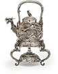 A large silver teapot, burner and stand By the Konoike workshop, Meiji period (late 19th century)