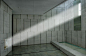 Canadian War Museum - Memorial Hall: On Remembrance Day at 11:00 a.m. the headstone of the Unknown Soldier is illuminated by sun entering through a small window.